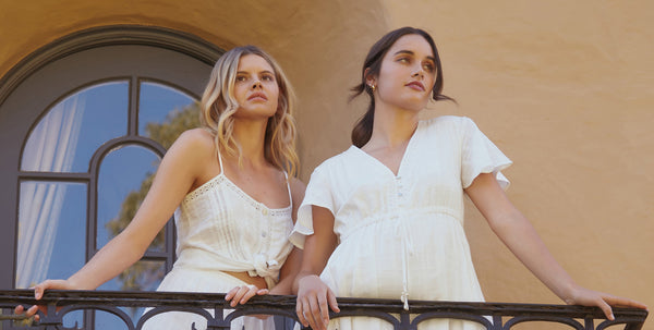 girls in byiris midi dress on upper floor